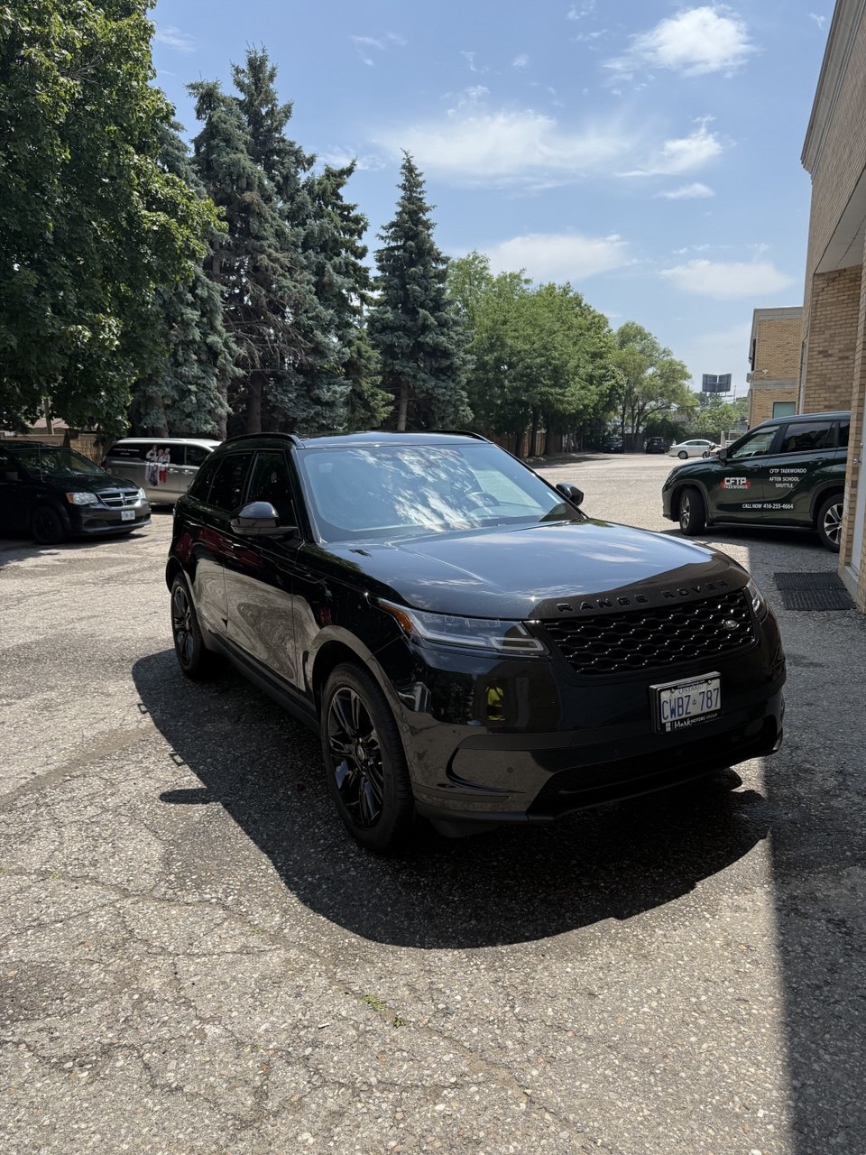Detailed black Mercedes SUV at a driveway